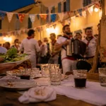 Table de fête pour fetes de villages landes, verres et assiettes sur une place de village